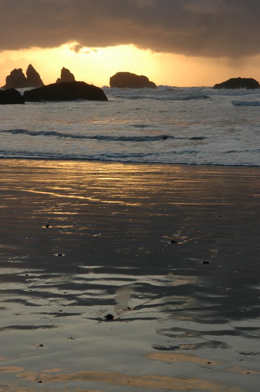 wet sand and setting sun